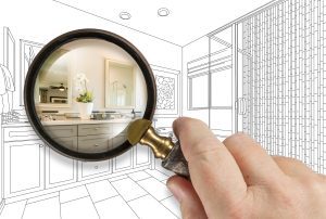 Magnifying Glass Revealing Custom Bathroom Design Drawing and Photo